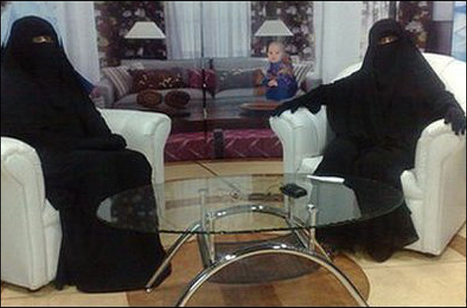 Covering the news ... interviewer and guest in full burkhas on Saudi religious station Awtan TV