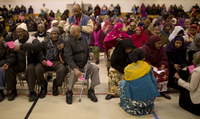 Somali Muslims sitting sharia style - men on one side, women on the other side