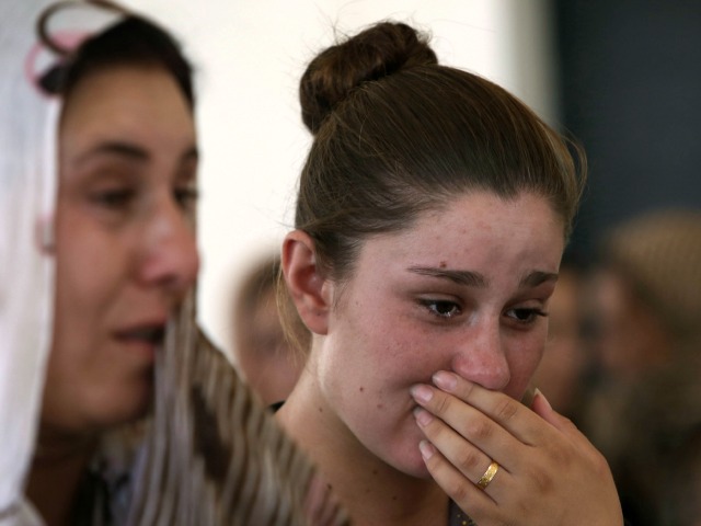 yazidi-woman-crying-afp